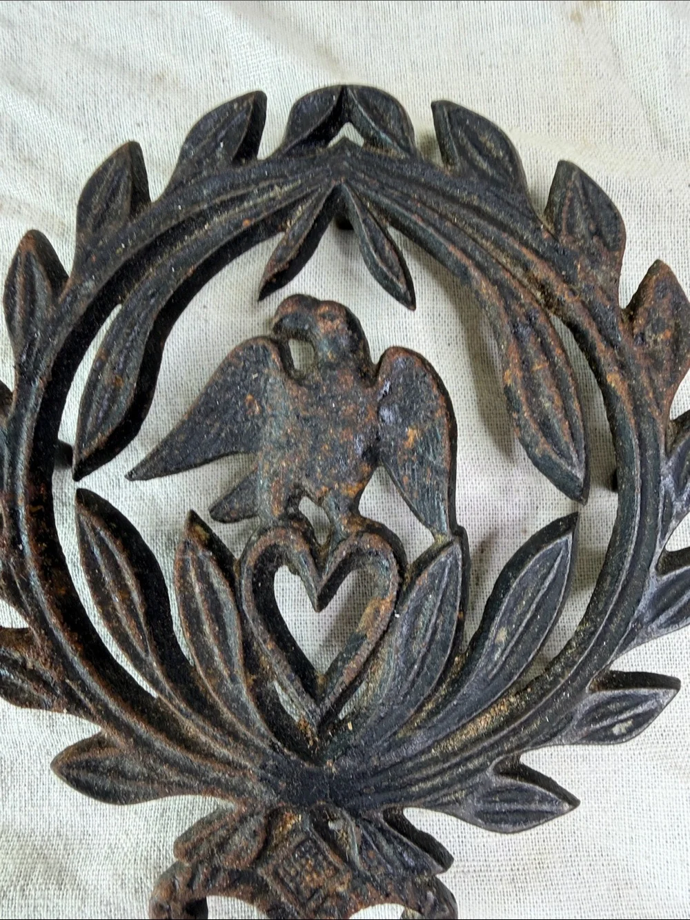 Rustic Black Cast Iron Wall Decor with Dove and Heart Motif